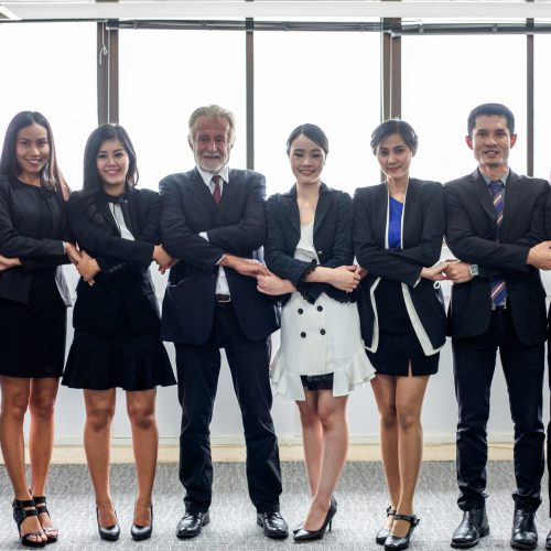 smiling happy Businessman and Businesswomen celebrating success Achievement Arm Raised and show thumb up Concept